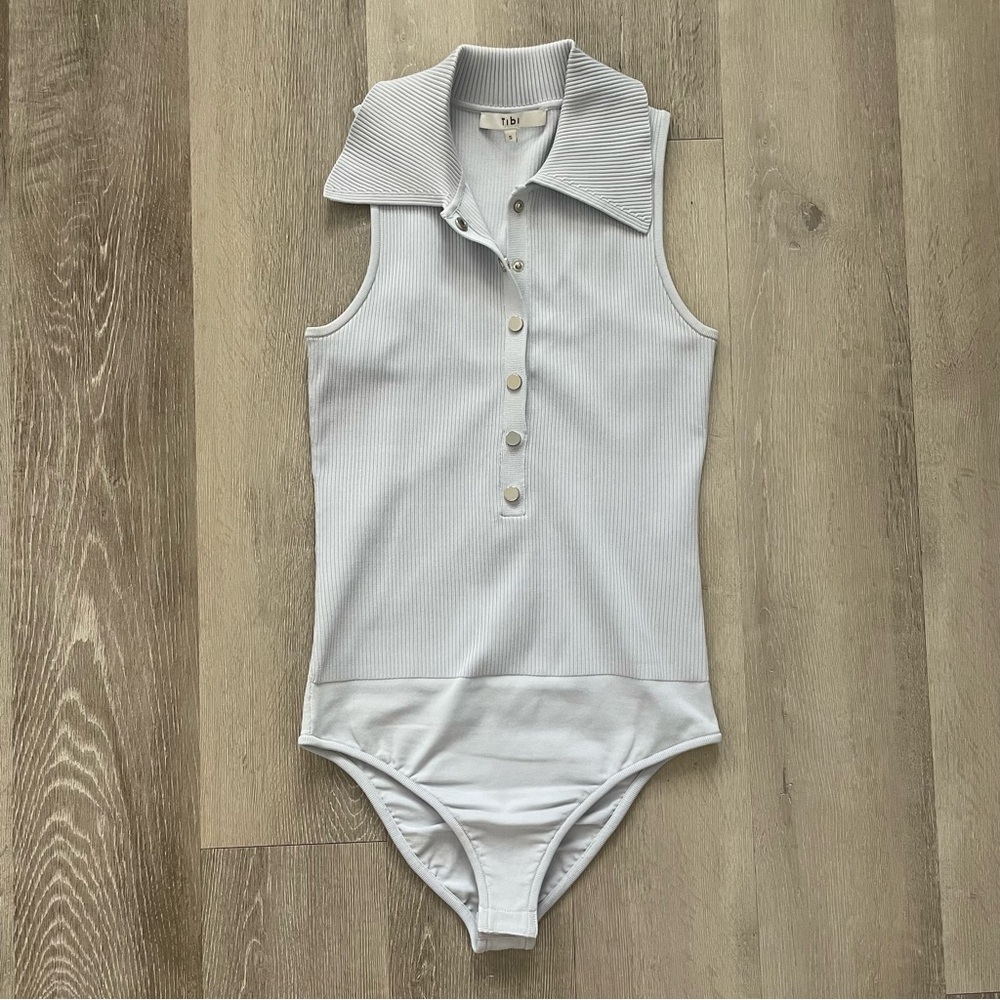 Tibi Ribbed Knit Button Snap Front Point Collared Polo Bodysuit in Light Blue